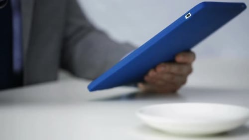 Close Up Of Man With Tablet Pc Drinking Coffee 3