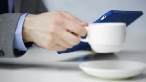 Close Up Of Man With Tablet Pc Drinking Coffee 4