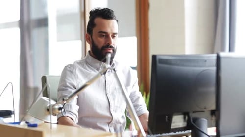 Happy Creative Male Office Worker With Computer 4