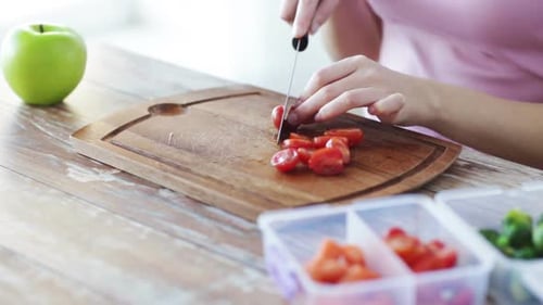 Close Up Of Woman Chopping Vegetables At Home 2