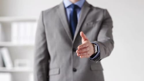 Close Up Of Businessman Giving Hand For Handshake 2