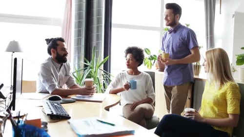 Happy Creative Team Drinking Coffee In Office 15