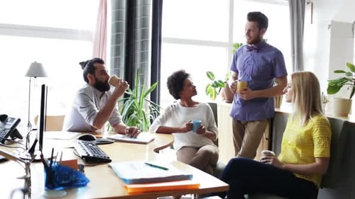 Happy Creative Team Drinking Coffee In Office 17