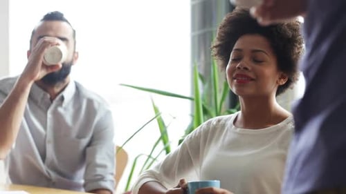 Happy Creative Team Drinking Coffee In Office 20