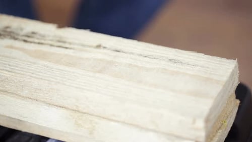 Close Up Of Man Hammering Nail To Wooden Board 7