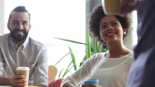 Happy Creative Team Drinking Coffee In Office 23