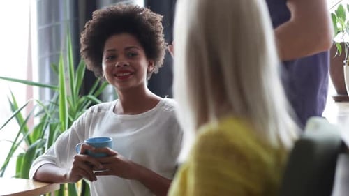 Happy Creative Team Drinking Coffee In Office 33