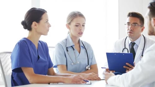 Group Of Doctors Meeting And Talking At Hospital 1