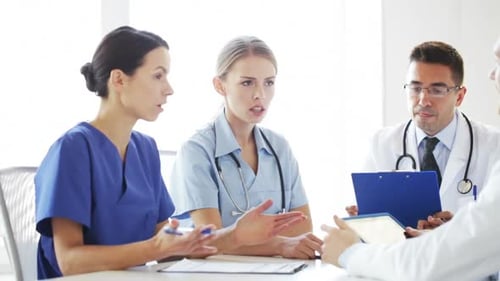 Group Of Doctors Meeting And Talking At Hospital 2