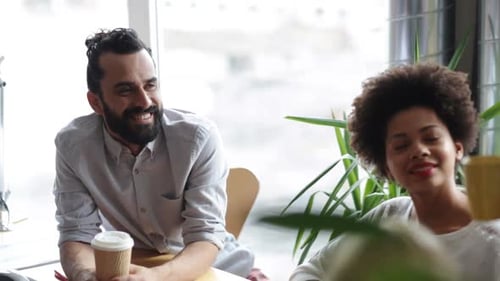 Happy Creative Team With Coffee Talking In Office 5