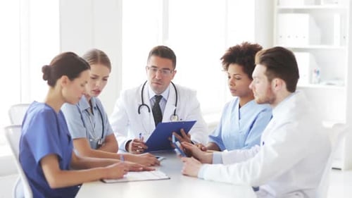 Group Of Doctors Meeting At Hospital Office 3