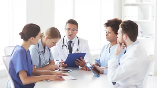 Group Of Doctors Meeting At Hospital Office 4
