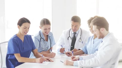 Group Of Doctors Meeting At Seminar In Hospital 4