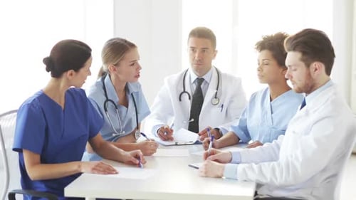 Group Of Doctors Meeting At Seminar In Hospital 5
