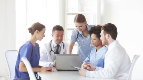 Group Of Doctors With Laptop Meeting At Hospital 2