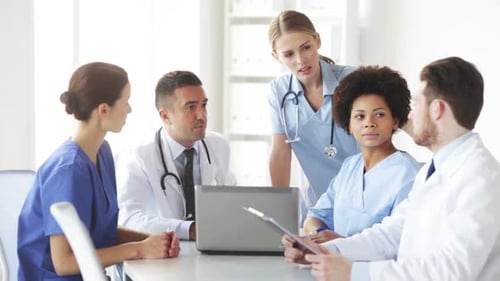 Group Of Doctors With Laptop Meeting At Hospital 3