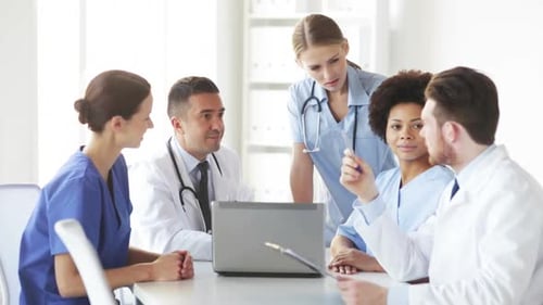 Group Of Doctors With Laptop Meeting At Hospital 4