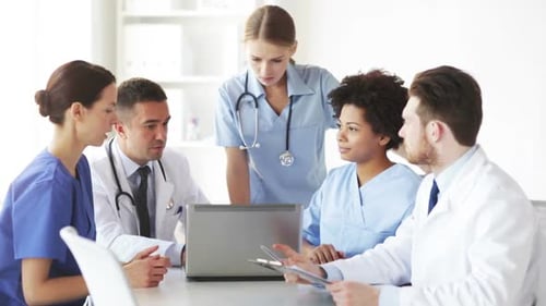 Group Of Doctors With Laptop Meeting At Hospital 6