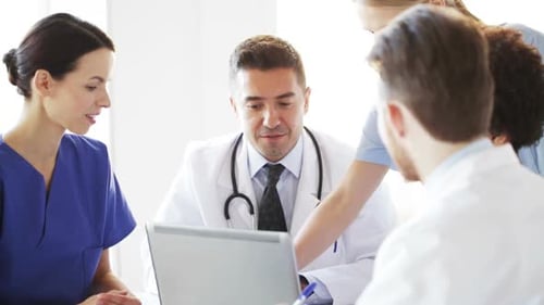 Group Of Doctors With Laptop Meeting At Hospital 8