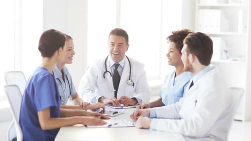 Group Of Happy Doctors Making High Five At Clinic 1