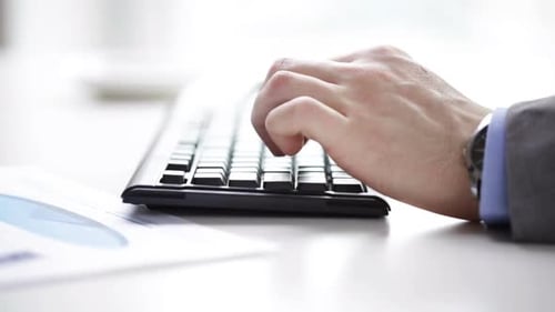 Close Up Of Businessman Typing And Drinking Coffee 6