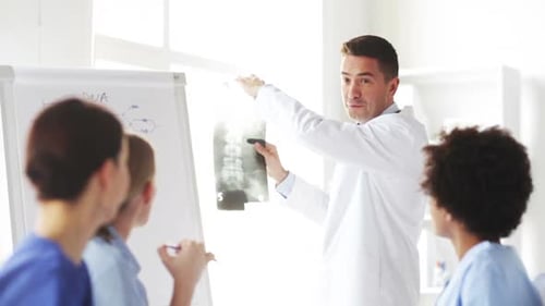 Group Of Happy Doctors With X-Ray At Hospital 1