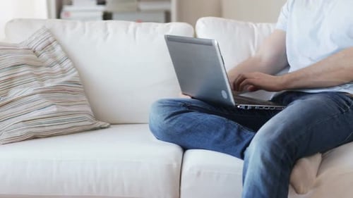 Close Up Of Man Typing On Laptop At Home 2
