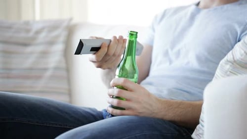 Close Up Of Man With Beer And Remote At Home 5