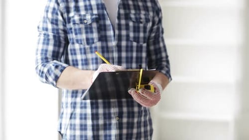 Close Up Of Man With Measuring Ruler And Clipboard 2