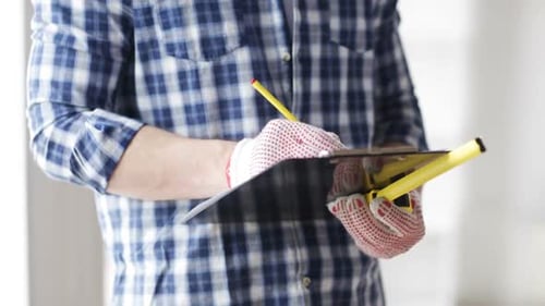 Close Up Of Man With Measuring Ruler And Clipboard 3