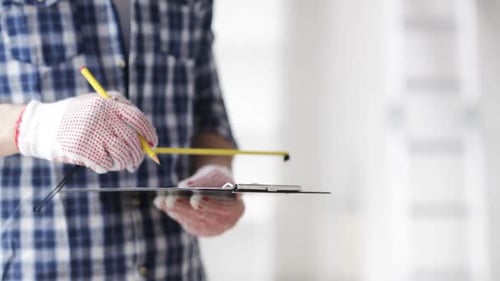 Close Up Of Man With Measuring Ruler And Clipboard 4