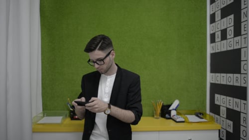 Young Man Text Messaging