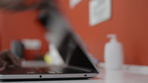Laptop Closes on a White Table