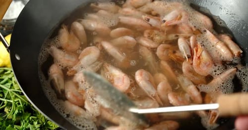 Cooking Delicious Boiled Shrimp. On a Dark Background.