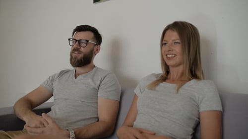 Man and Woman Sitting on Couch Having a Conversation