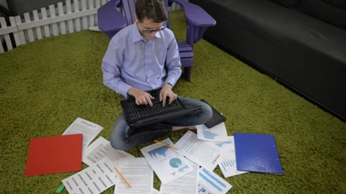 Working On Laptop on Floor at Home