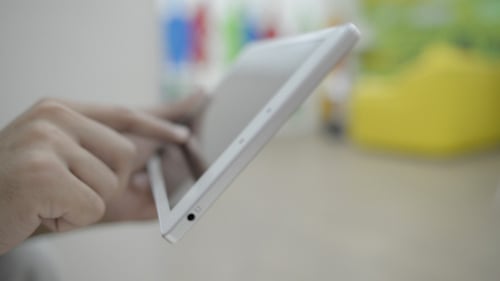 Fingers Using Tablet Touchscreen Device