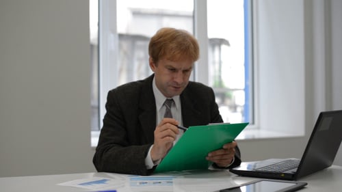 Man Working at Desk in Office