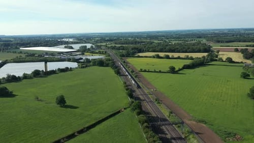 Railway in the countryside and trains passing, aerial view