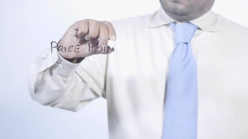 Asian Businessman Writes Price Points