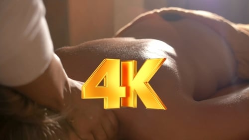 Woman Getting Hot Stone Body Massage At Beauty Spa