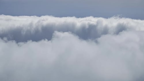 Billowing White Clouds Against a Pale Blue Sky