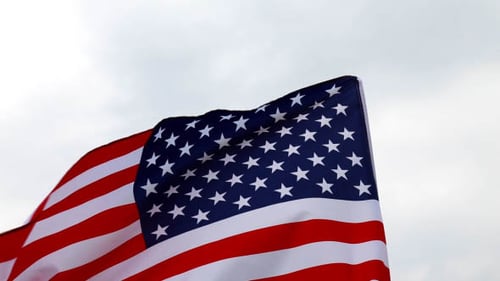 Waving American Flag Against a Gray Sky