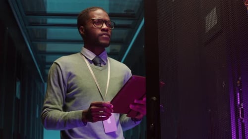 IT Specialist Working in Server Room of Data Center