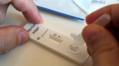 Hands Perform COVID-19 Antigen Test Close Up