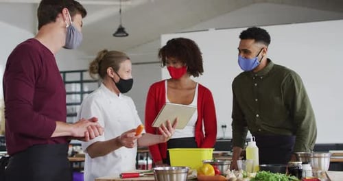 Adults Attending a Cooking Class Wearing Face Masks