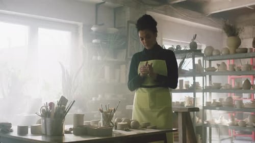 Beautiful Woman In Pottery Workshop