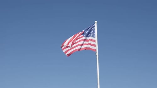 Against blue sky USA national symbol on pole in slow-mo 1920X1080 HD footage - Slow motion United