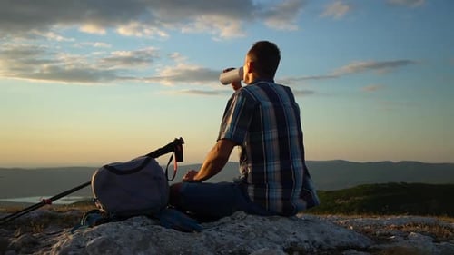 Travel Mountain Hike Young Male Hiker Drinking Water and Looking at Beautiful Natural Scenery in