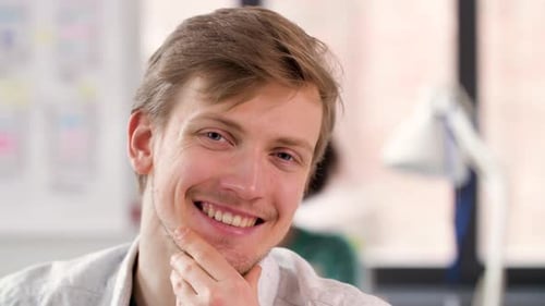 Portrait of Happy Smiling Young Man at Office 59